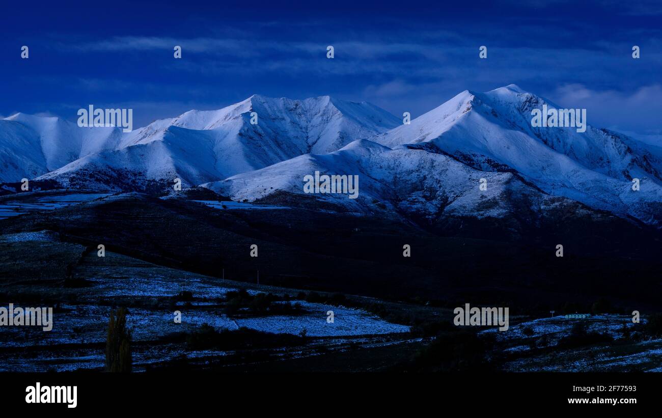 Twilight and blue hour in Pyrenees, at Pica Cerví summit, viewed from the Creu de Perves pass (Alta Ribagorça, Catalonia, Pyrenees, Spain) Stock Photo