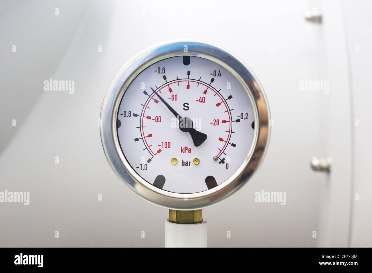 Vacuum pressure gauge, part of vacuum chamber in laboratory Stock Photo