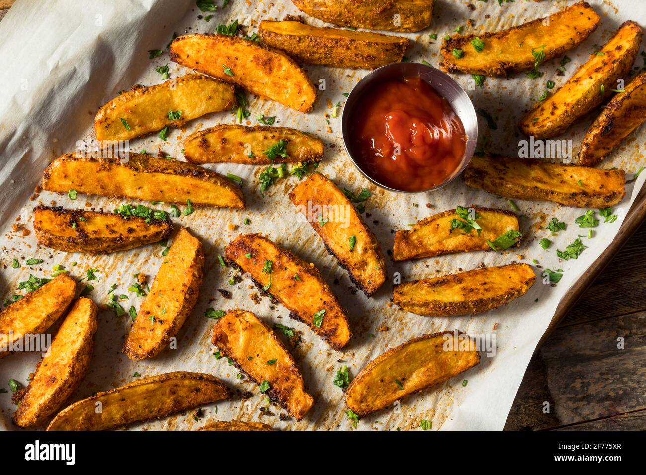 Homemade Spicy Oven Fried Potato Wedges with Ketchup Stock Photo Alamy