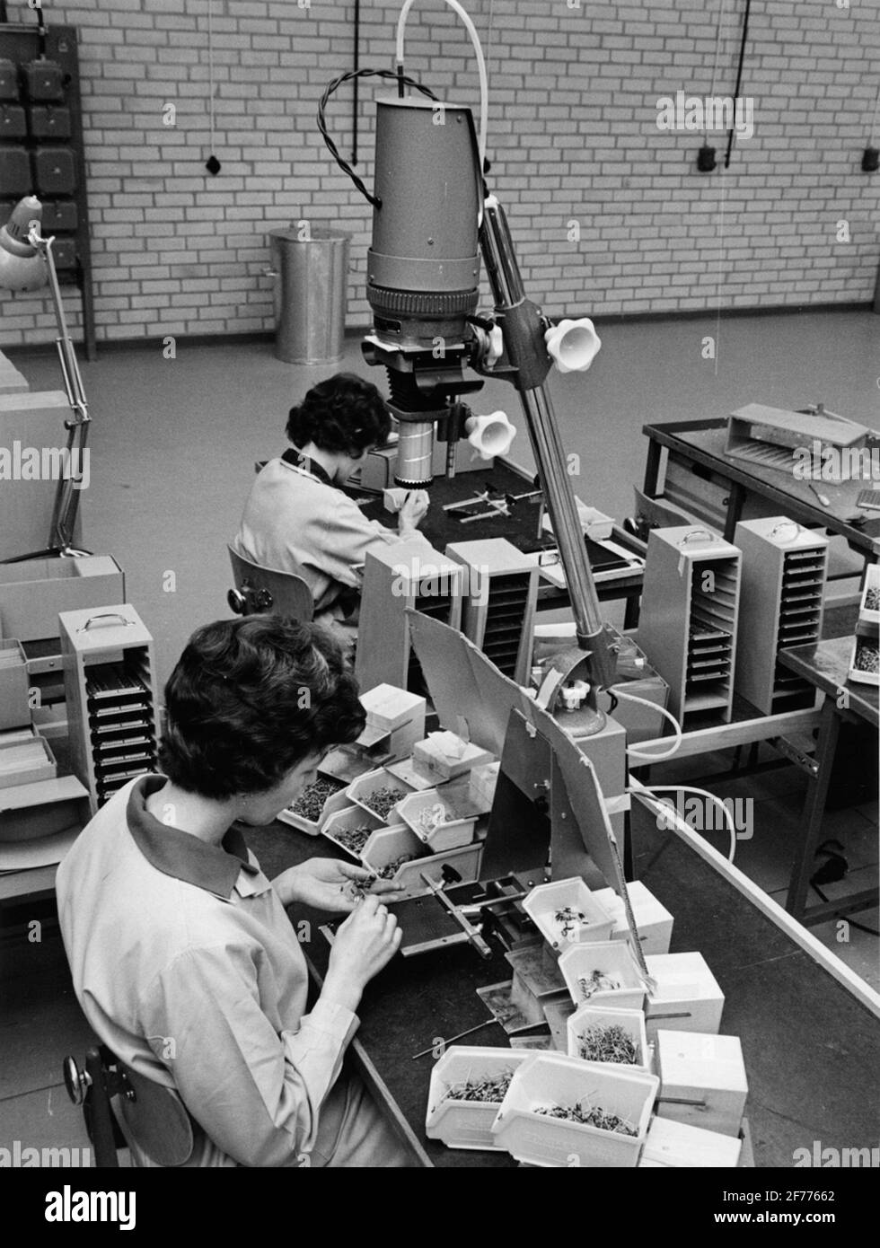 Standard radio factory in Ulvsunda, Stockholm. Mounting of electronics  systems. MTM chain for card assembly. At the shooting, a news for SRT.  Instead of the drawing that work base was photographed and