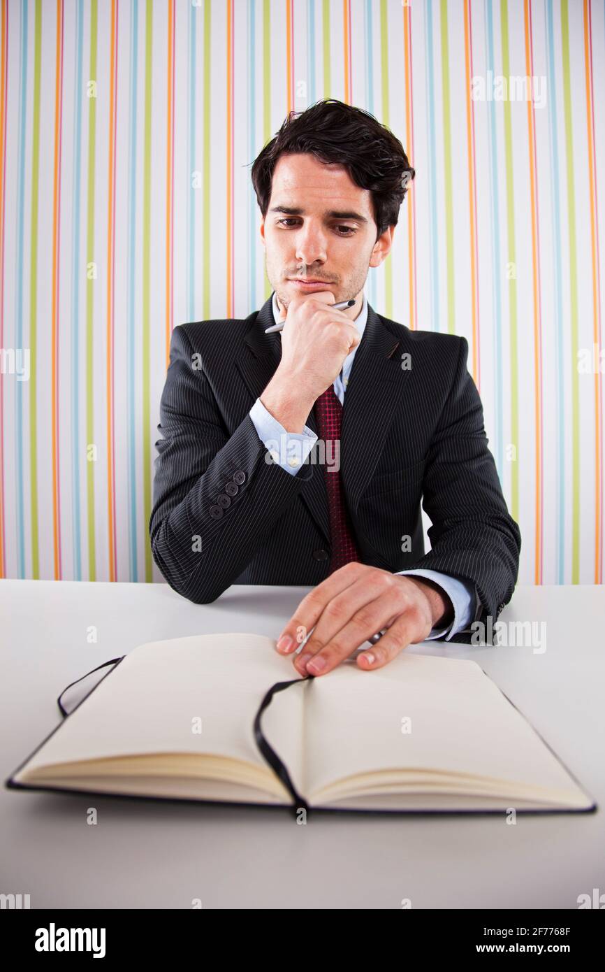 Businessman sitting desk making paper hi-res stock photography and ...