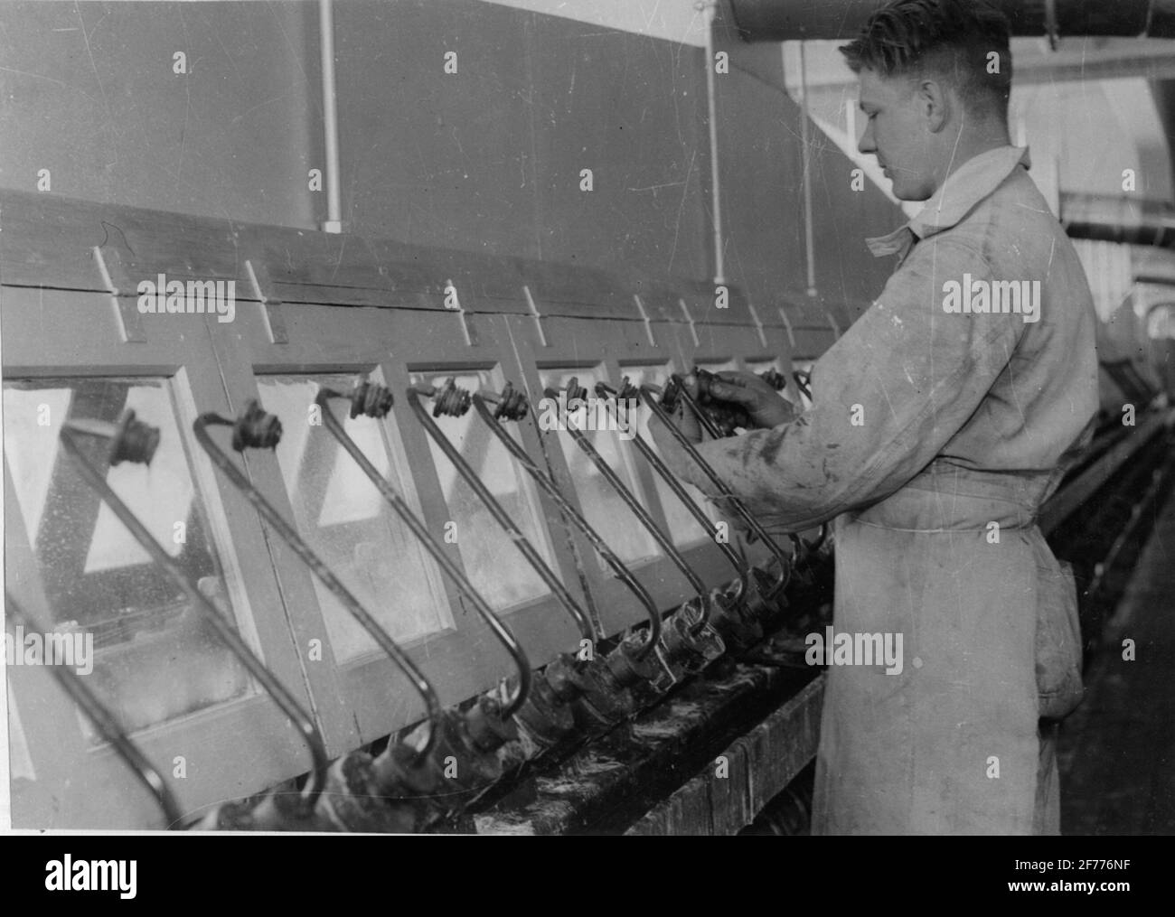 The limited company Nordic silk cellulose. Staple phase machine's spinning department. The nozzle is applied. Stock Photo