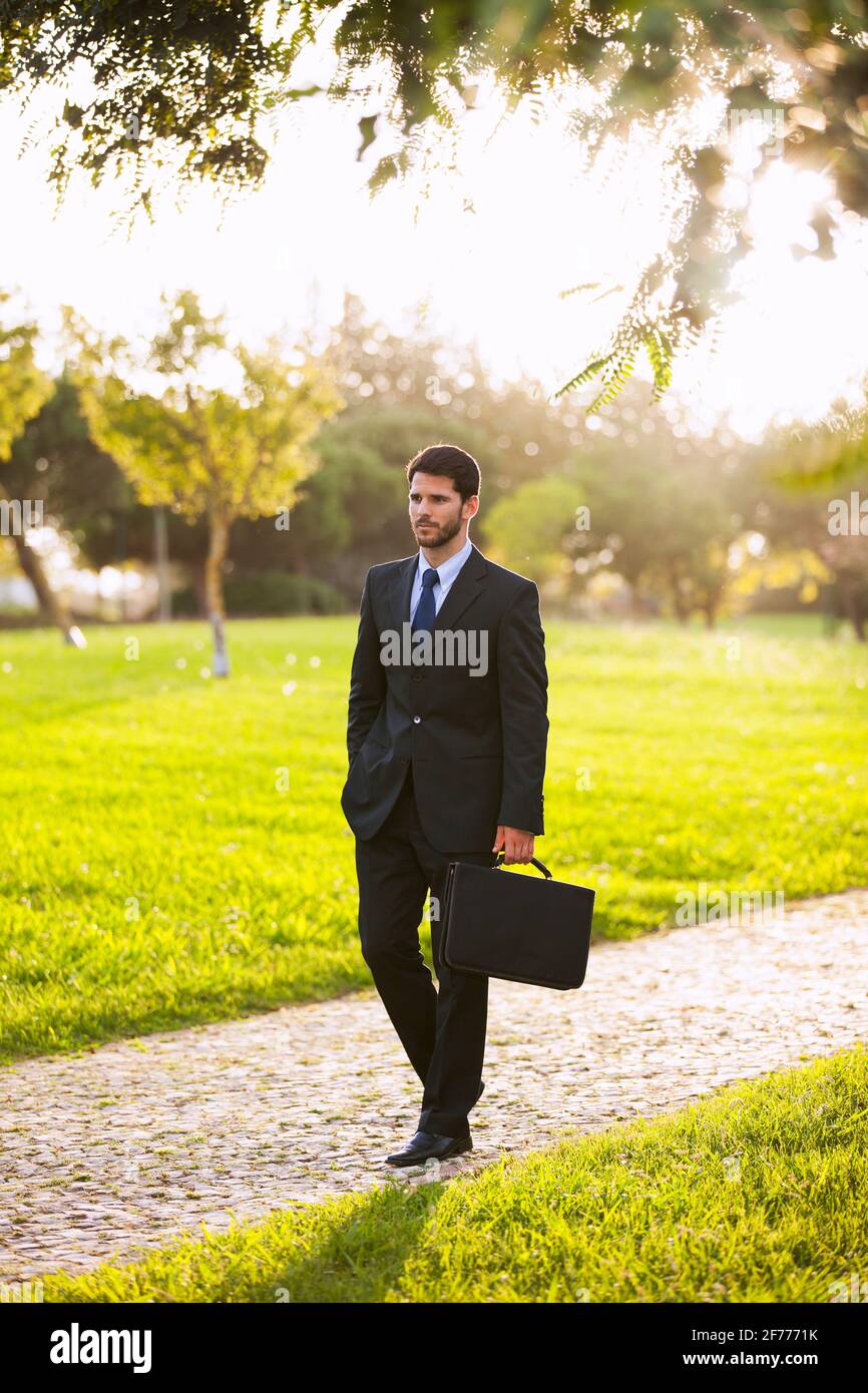 Walking man in suit outside hi-res stock photography and images - Alamy