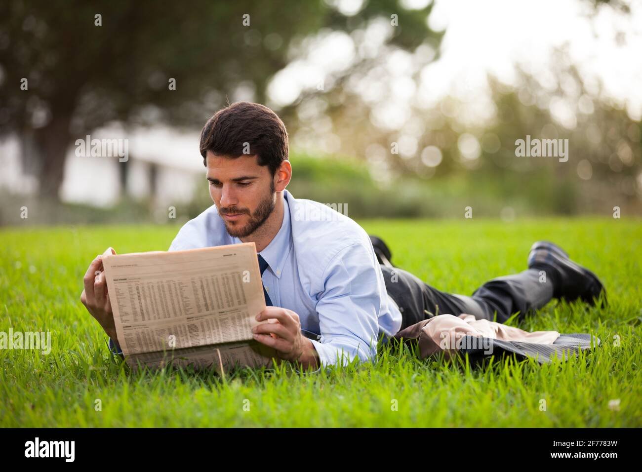Businessman reading the newspaper Stock Photo