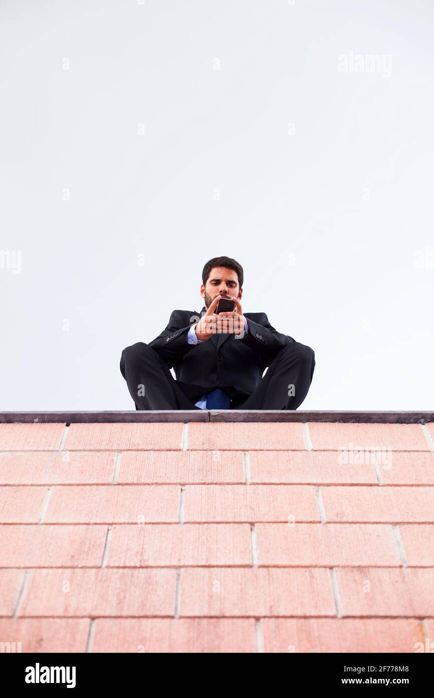 Businessman using his smartphone Stock Photo