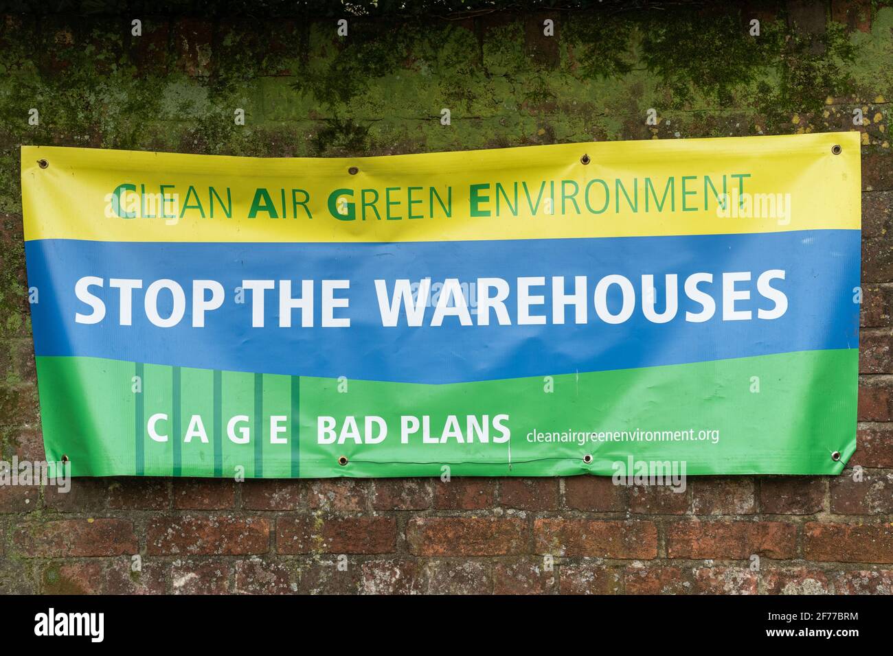 Stop the Warehouses protest banner, Clean Air Green Environment, objecting to plans to build large Amazon warehouses near Dummer, Hampshire, UK, 2021 Stock Photo