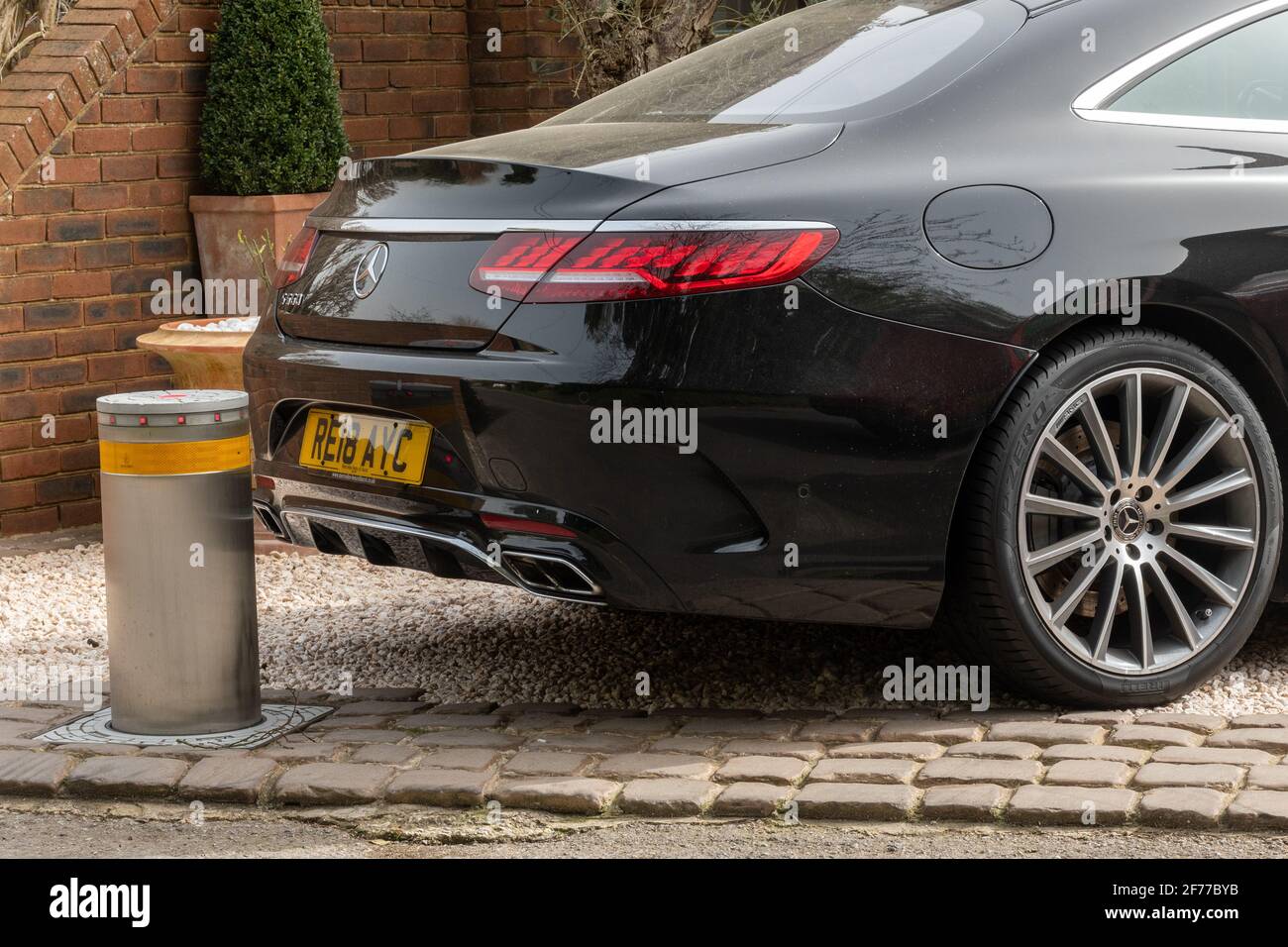 Rising bollard as an antitheft device in a private driveway to prevent