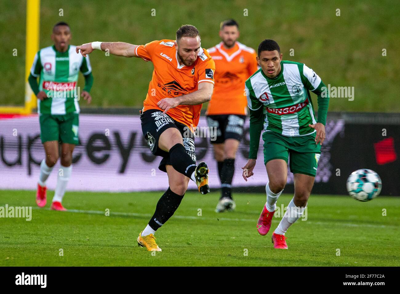Deinze's Raphael Lecomte and Lommel's Diego Silva Rosa fight for the ball during a soccer match between KMSK Deinze and Lommel SK, Monday 05 April 202 Stock Photo