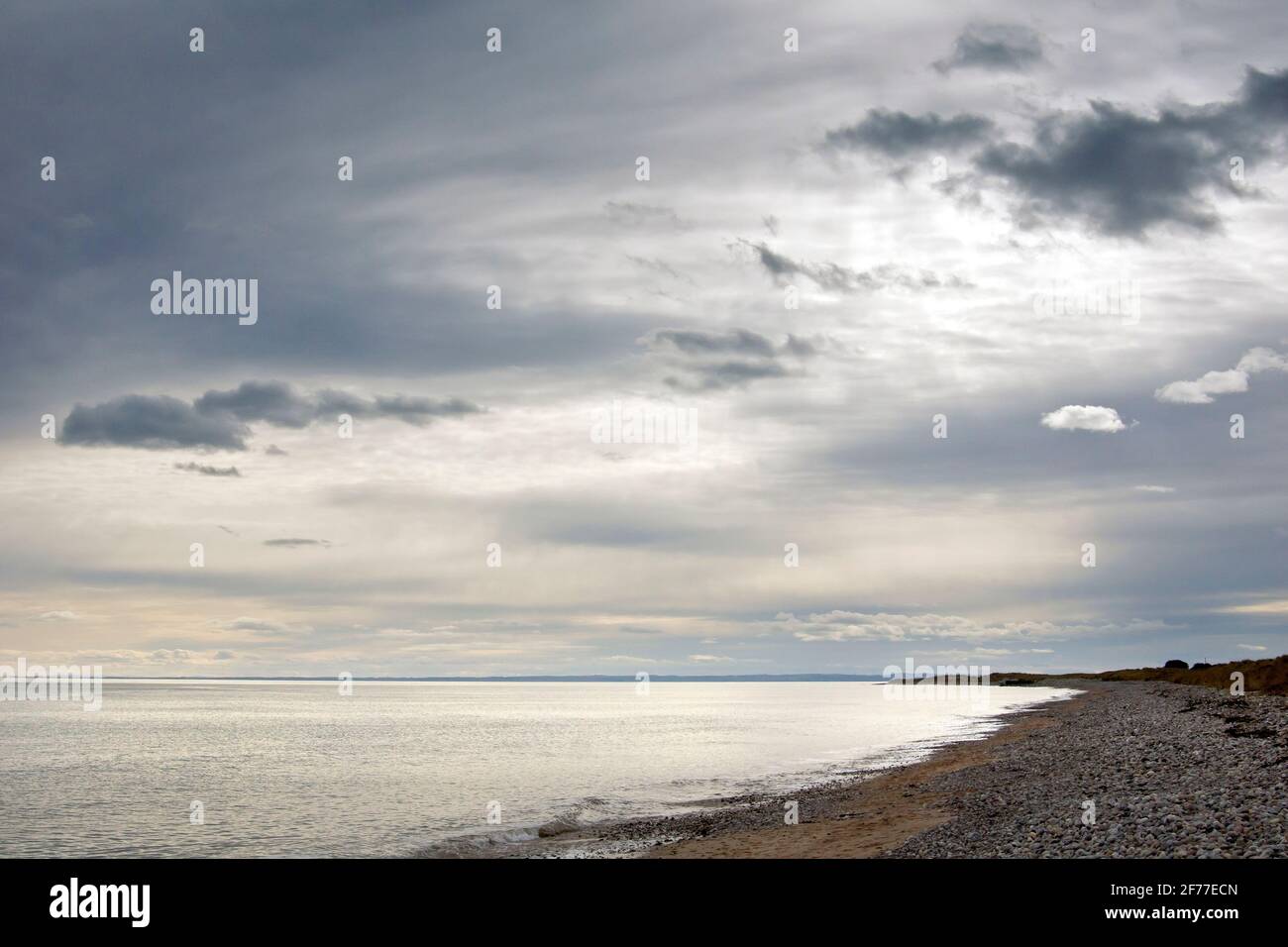 The beach at Arbroath on an overcast day, the cloud thin enough to allow the sunlight through creating a rather ethereal light in the image. Stock Photo