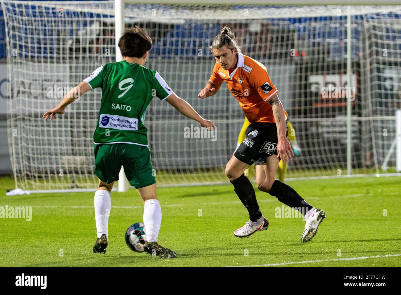 Lommel's Koki Saito and Deinze's Seth De Witte fight for the ball during a soccer match between KMSK Deinze and Lommel SK, Monday 05 April 2021 in Dei Stock Photo