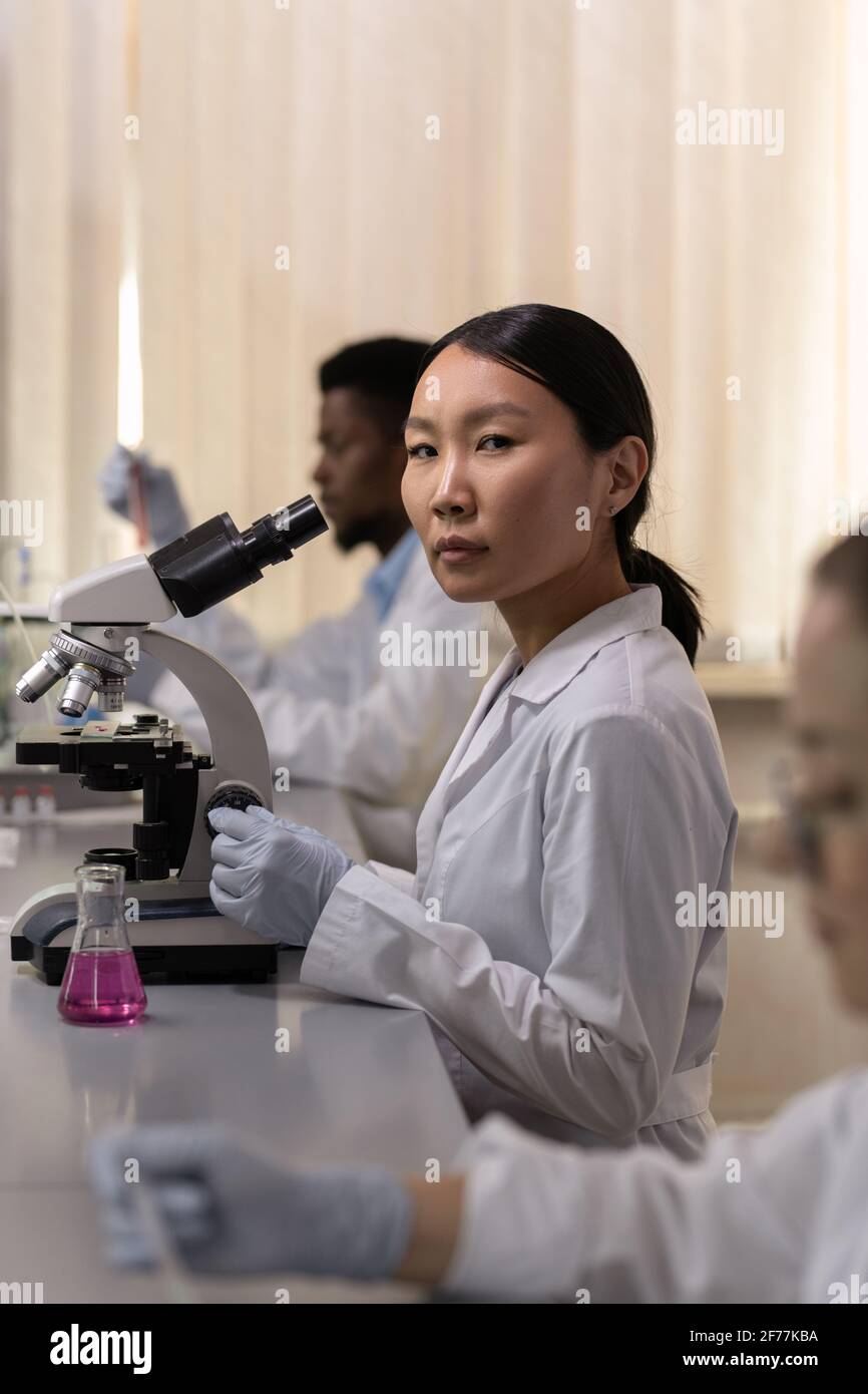 Indian doctor with microscope hi-res stock photography and images - Alamy