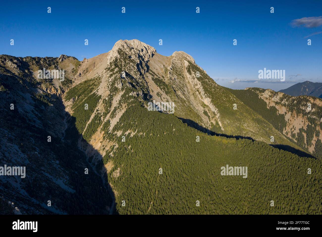 Pedraforca west face aerial view in a spring afternoon over Gósol Valley (Barcelona province, Catalonia, Spain, Pyrenees) Stock Photo