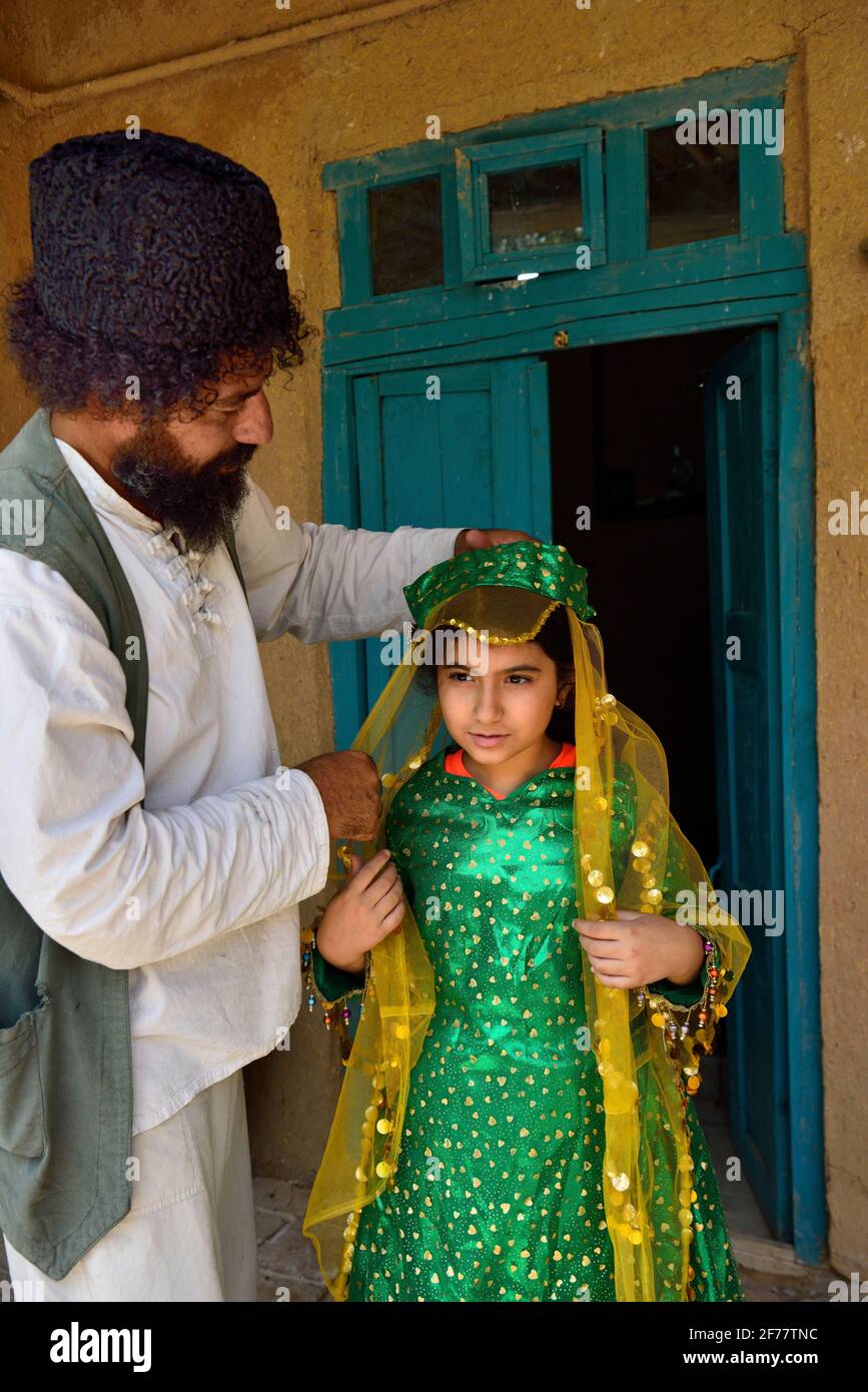 Iran, Fars province, Pasargad Sadat, Little girl getting dressed for a wedding Stock Photo