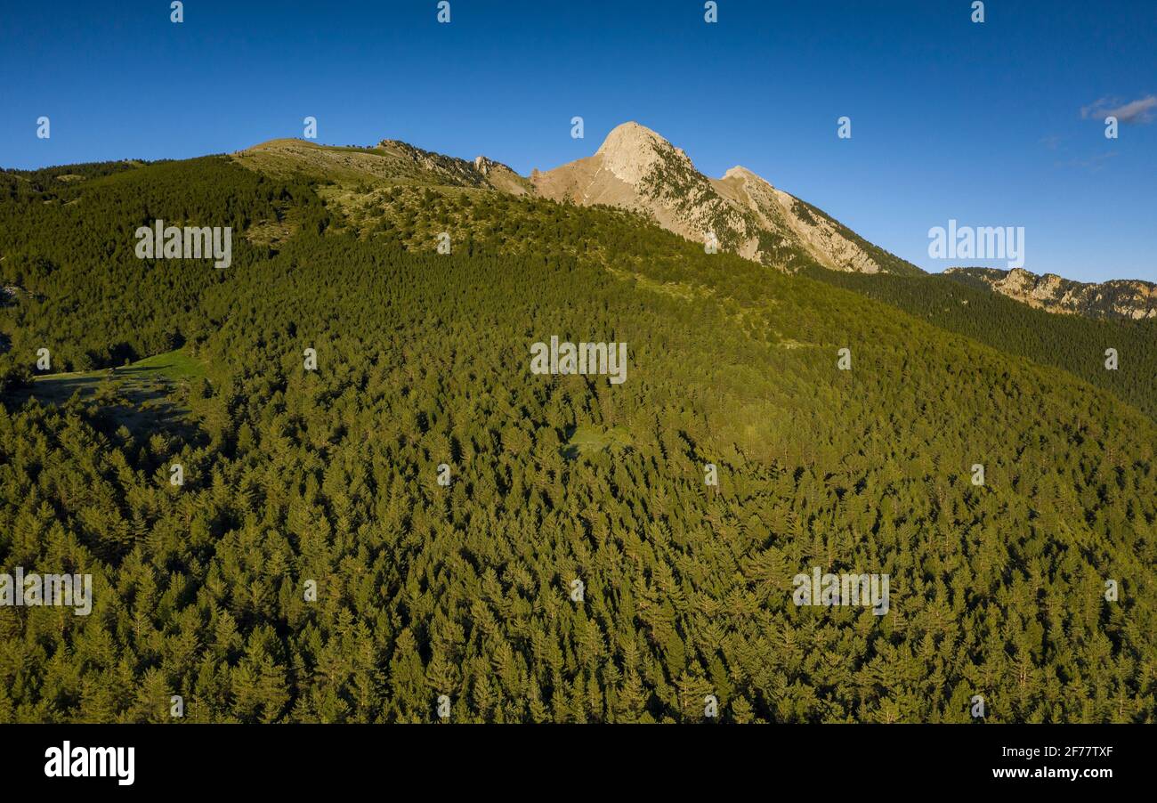 Pedraforca west face aerial view in a spring afternoon over Gósol Valley (Barcelona province, Catalonia, Spain, Pyrenees) Stock Photo