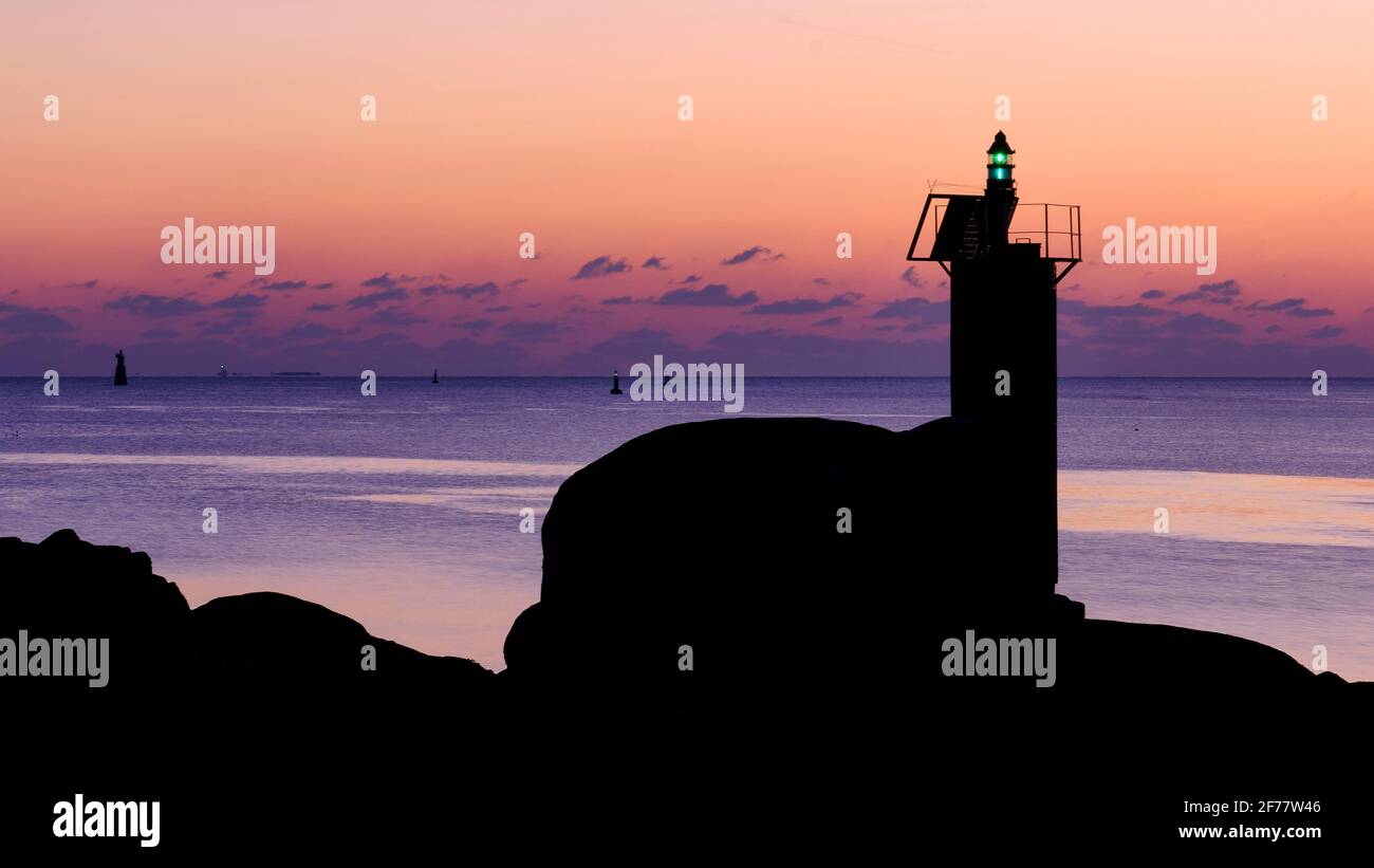 France, Finistere, Concarneau, the beacon at the entrance to the harbour channel at dusk Stock Photo
