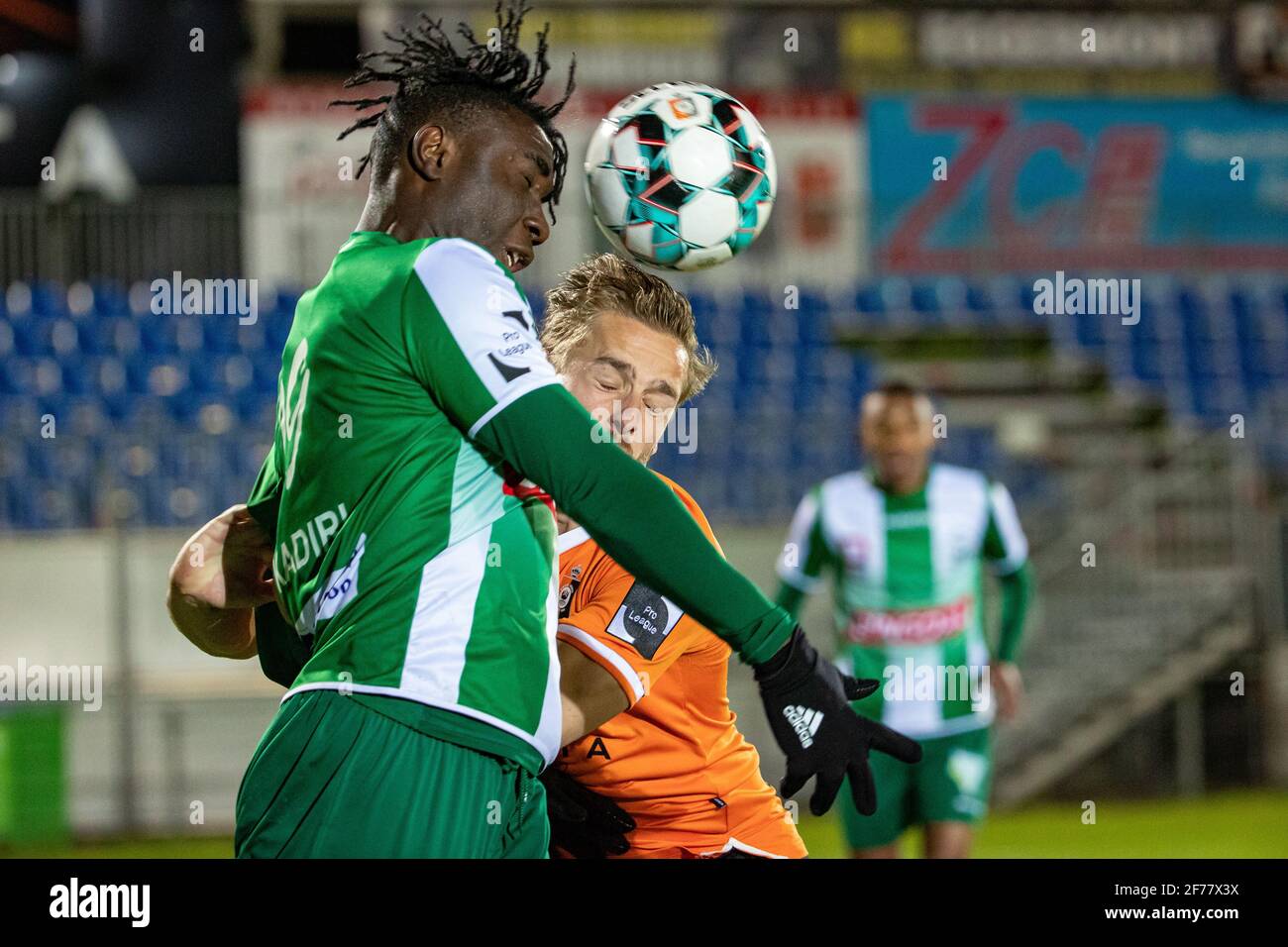 Lommel's Jordan Attah Kadiri and Deinze's Alessio Staelens fight for the ball during a soccer match between KMSK Deinze and Lommel SK, Monday 05 April Stock Photo