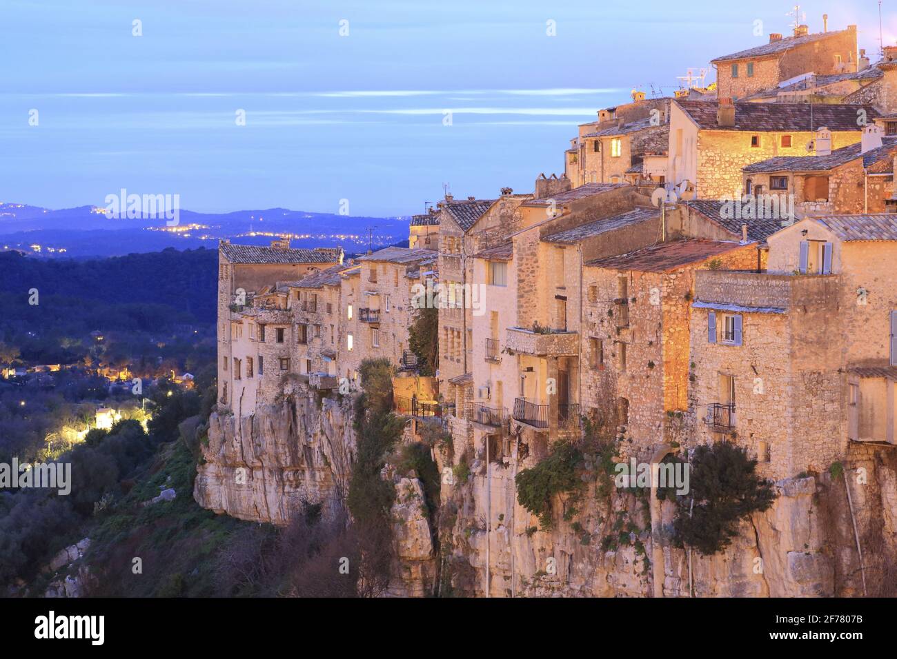 France, Alpes Maritimes, Tourrettes sur Loup, general view at nightfall on the medieval village located on a rocky outcrop Stock Photo