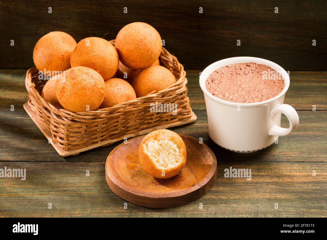 Traditional Colombian buñuelo Deep Fried Cheese Bread. Hot chocolate