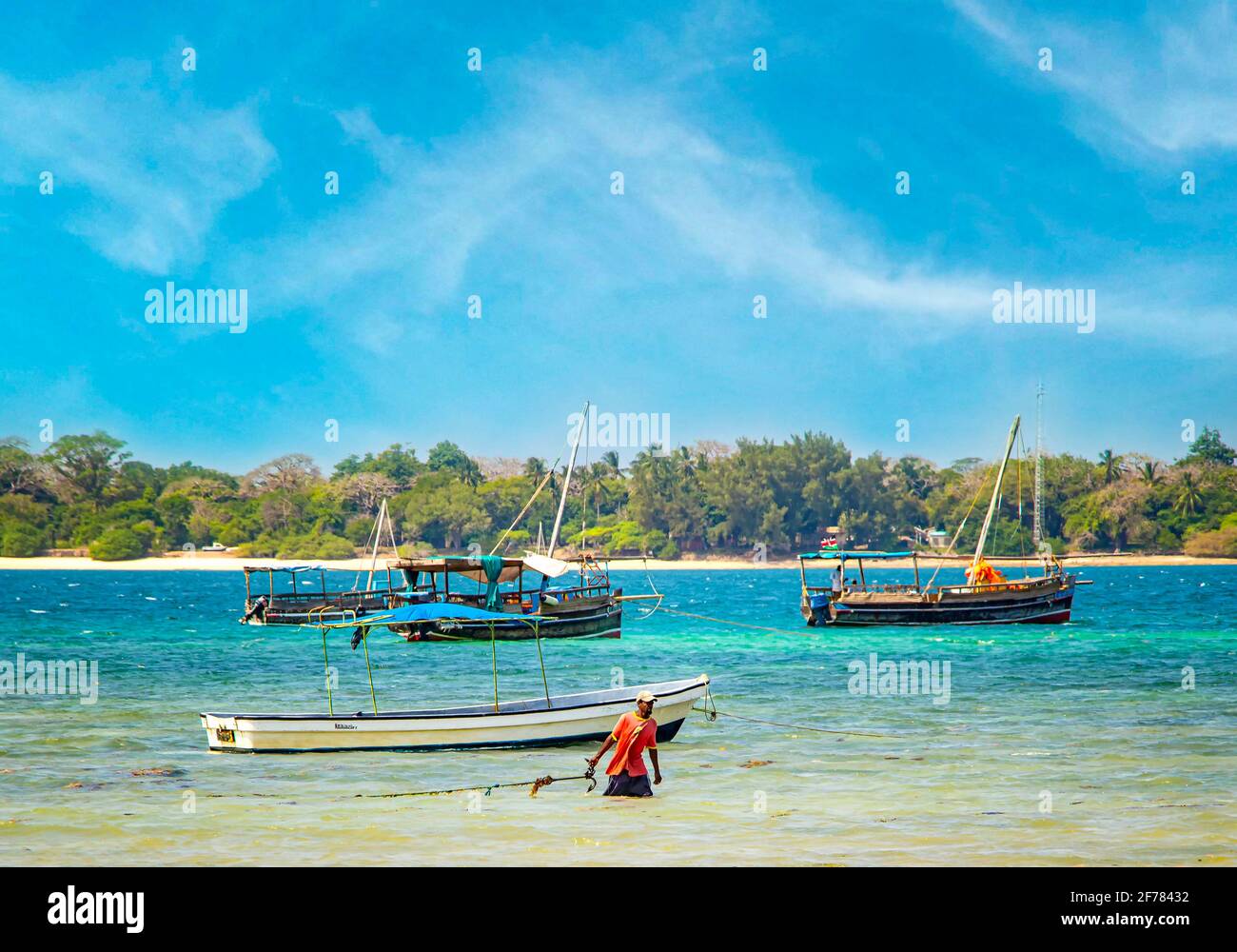 Wasini island, Kenya, AFRICA - February 26, 2020: Landscape view on ships and small boats on the water on wild island. It is the pure blue Indian Stock Photo