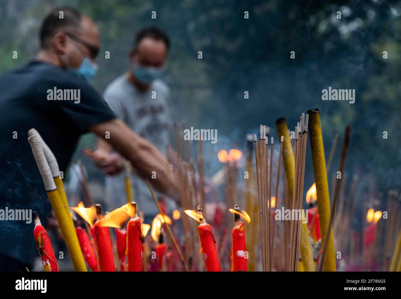 Hong Kong, China. 04th Apr, 2021. People burn incense at a cemetery