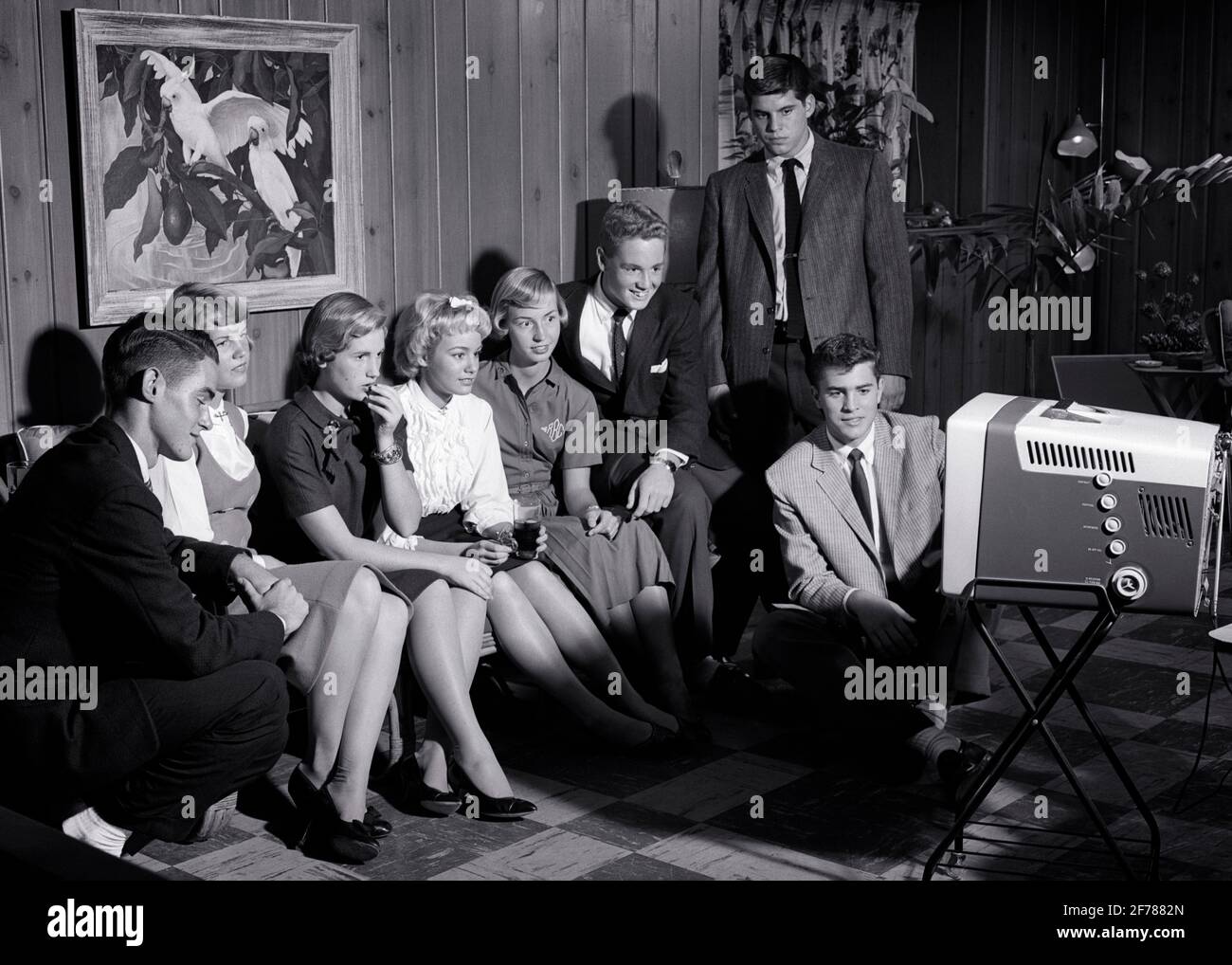 1950s 1960s GROUP OF TEENS BOYS AND GIRLS WATCHING A PORTABLE TELEVISION IN REC ROOM - j211 HAR001 HARS JOY LIFESTYLE CELEBRATION FEMALES BROTHERS HOME LIFE COPY SPACE FRIENDSHIP FULL-LENGTH PERSONS INSPIRATION CARING MALES TEENAGE GIRL TEENAGE BOY ENTERTAINMENT SIBLINGS SISTERS PORTABLE B&W SCHOOLS WIDE ANGLE SUIT AND TIE 8 HAPPINESS DISCOVERY LEISURE AND EXCITEMENT KNOWLEDGE POWERFUL REC RECREATION A IN OF HIGH SCHOOL SIBLING HIGH SCHOOLS CONNECTION CONCEPTUAL STYLISH TEENAGED EIGHT GROWTH IDEAS JUVENILES RELAXATION TOGETHERNESS BLACK AND WHITE CAUCASIAN ETHNICITY HAR001 OLD FASHIONED Stock Photo