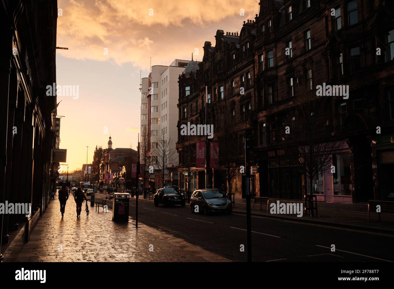 A quiet Sauchiehall Street before sunset, during lockdown. Glasgow city centre, April 2021. Stock Photo