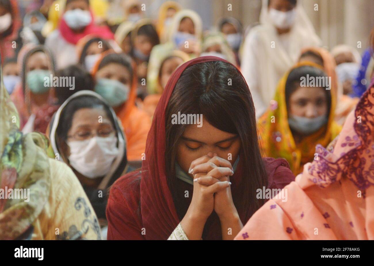 Lahore, Pakistan. 04th Apr, 2021. Pakistani Christian worshipers pray during an Easter mass at Catholic Sacred Heart Cathedral Church in Lahore. Arch bishop Sebastian Francis Shaw leading the mass prayer at Catholic Sacred Heart Cathedral Church .Christians around the world are marking of Easter Sunday during Holy Week were Christians observed and celebrated the Easter with special Easter mass prayer ceremonies across the Lahore and globally on Sunday. (Photo by Rana Sajid Hussain/Pacific Press/Sipa USA) Credit: Sipa USA/Alamy Live News Stock Photo