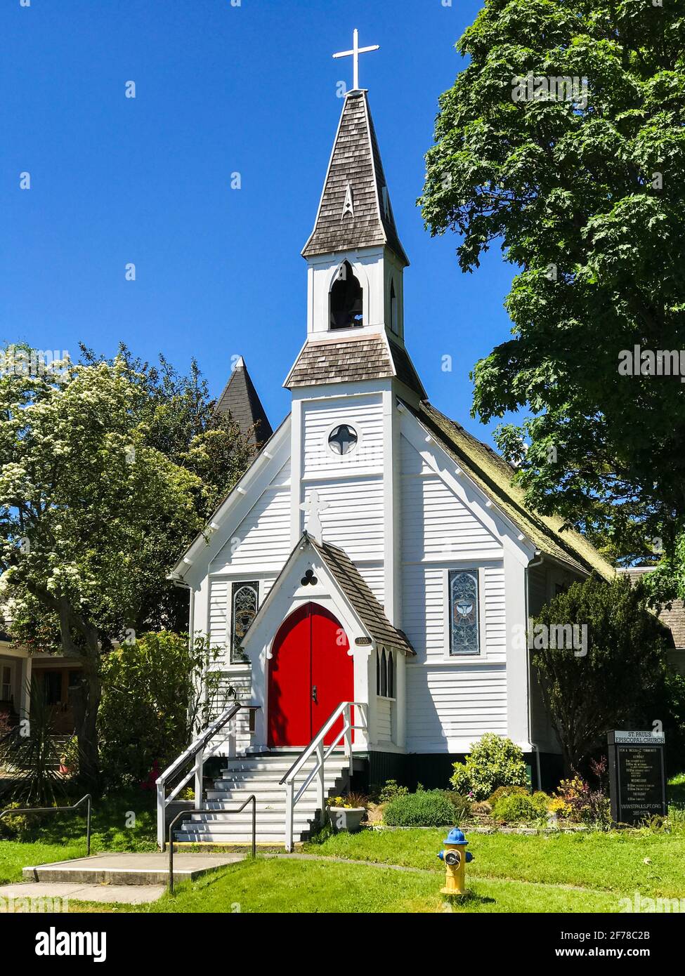 St Paul's Episcopal Church in Port Townsend Washington State is a white church with a red door that is a spectacular local landmark Stock Photo