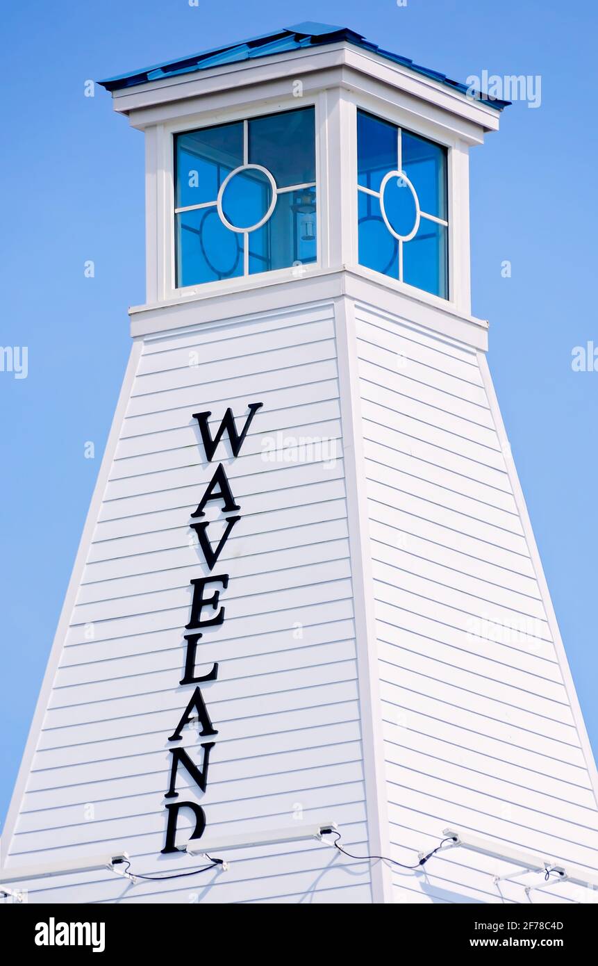 The Waveland Lighthouse serves as a public restroom and comfort station for beachgoers near the Garfield Ladner Pier in Waveland, Mississippi. Stock Photo