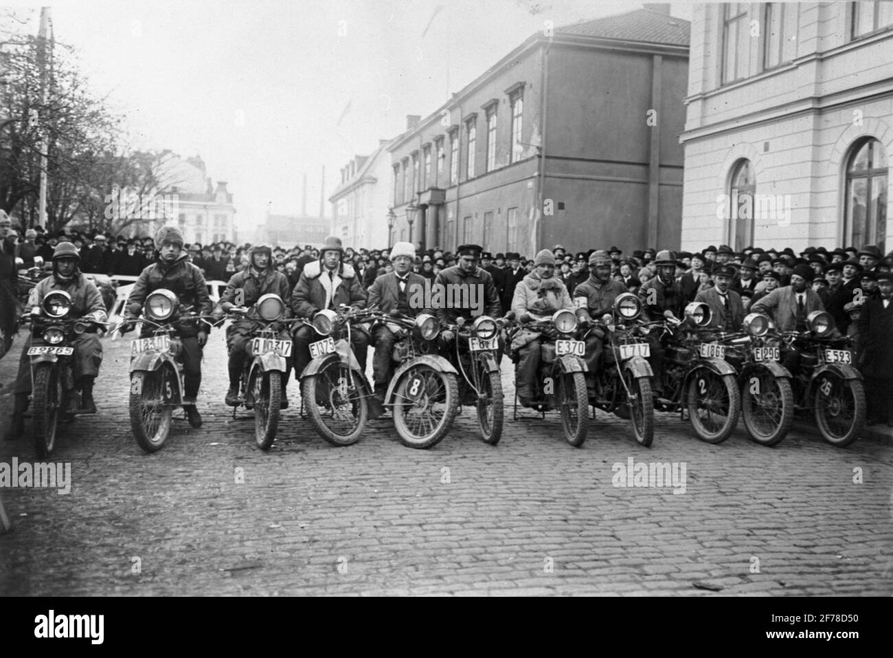 Group of the eleven participants in 'Husqvarna' motorcycle competition. The start in the November box in 1922 in Norrköping. Stock Photo