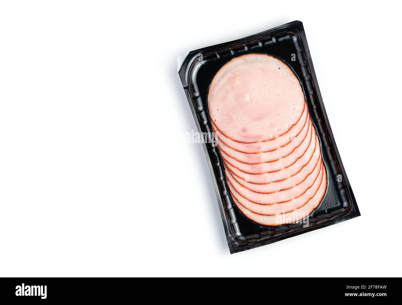Vacuumpacked ham isolated on a white background. Top view with copy