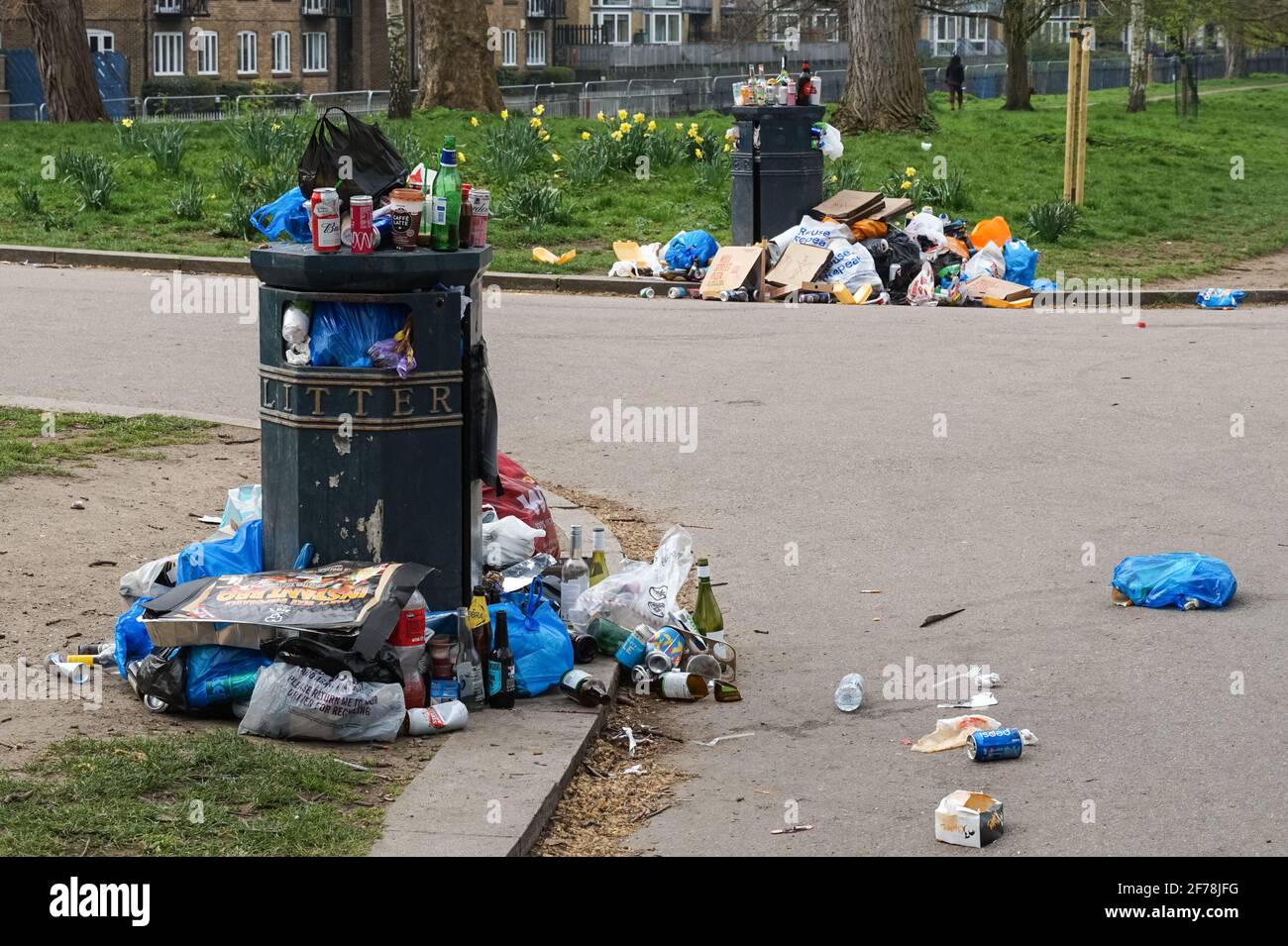 Overfilled waste bin in London park, England United Kingdom UK Stock