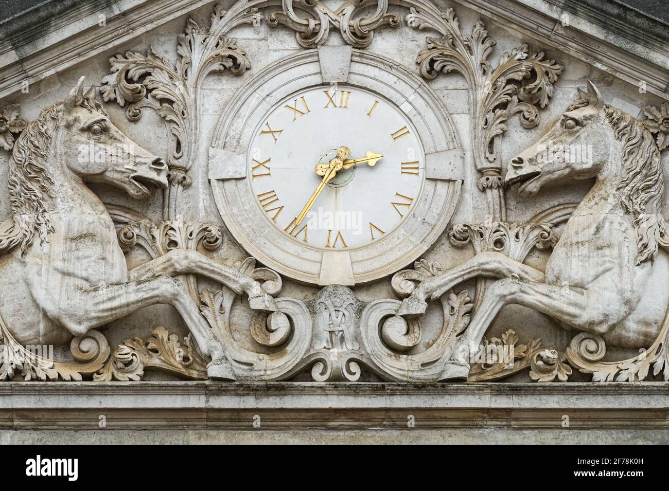 Clock and horse ornamental sculptures on the Household Cavalry Mounted Regiment building in London, England United Kingdom UK Stock Photo