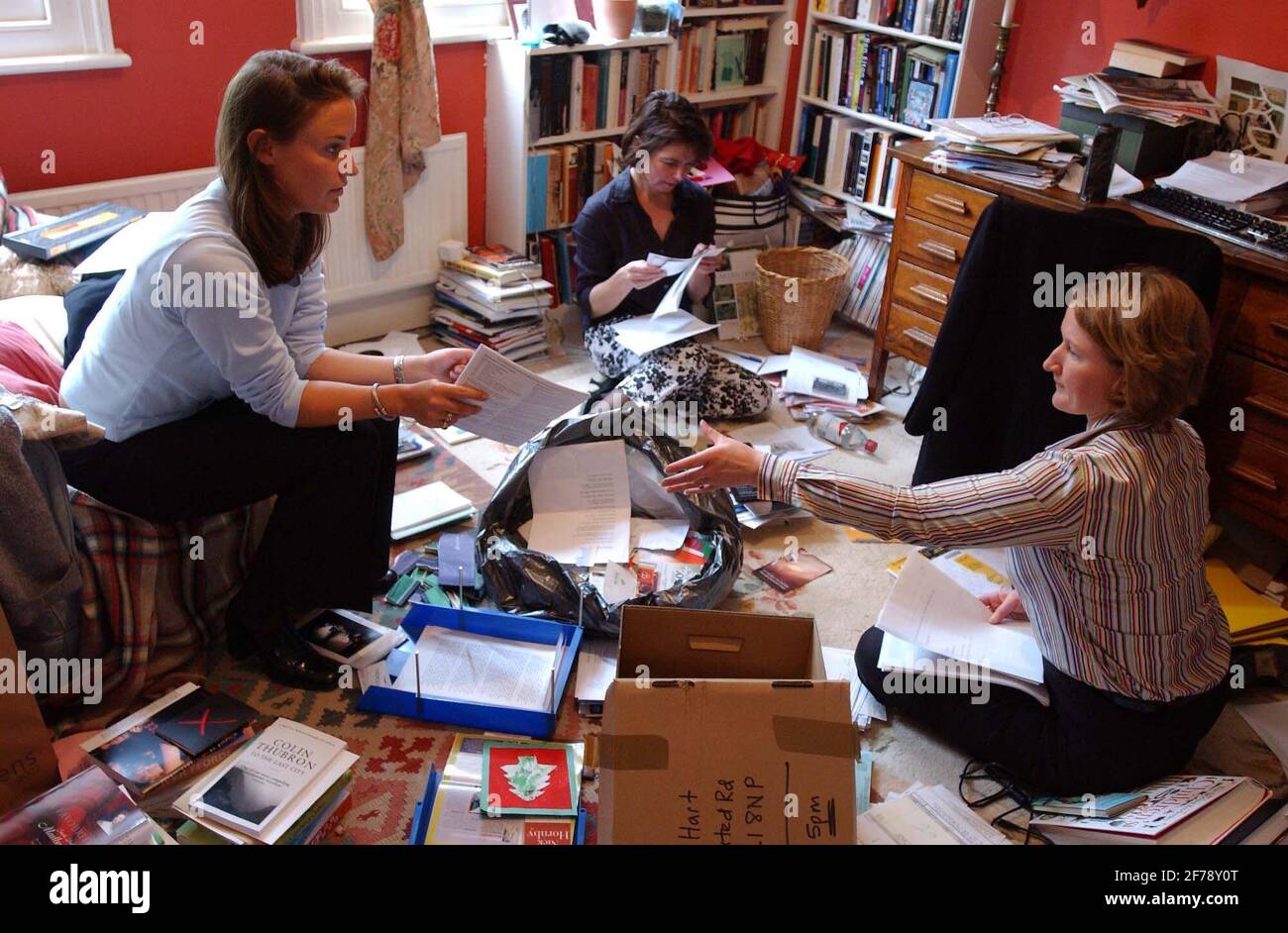 Suzanna Wilson (left) and Emma Chapman (right), Account Managers from the company Hire Intelligence, at the home of Carolyn Hart (centre).20 May 2002 photo Andy Paradise Stock Photo