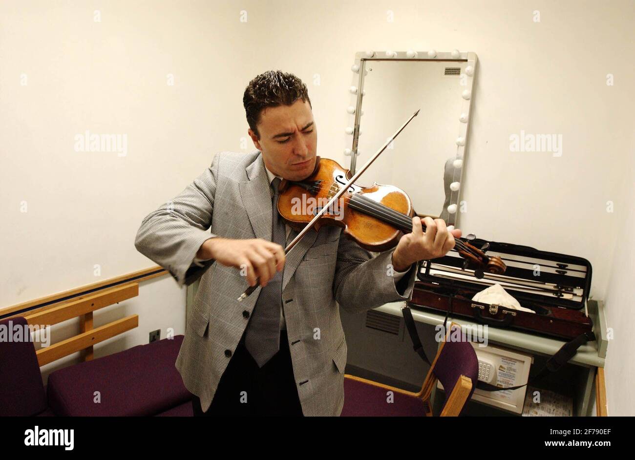 Violinist Maxim Vengerov tuning up before the award ceremony of the