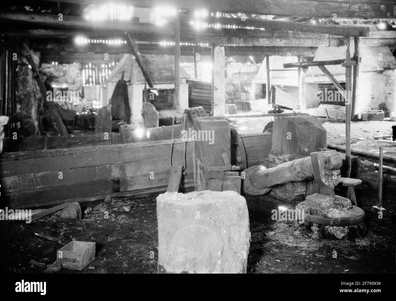 Interior of great smithy. In the forebay bundle hammer (upper hammer ...