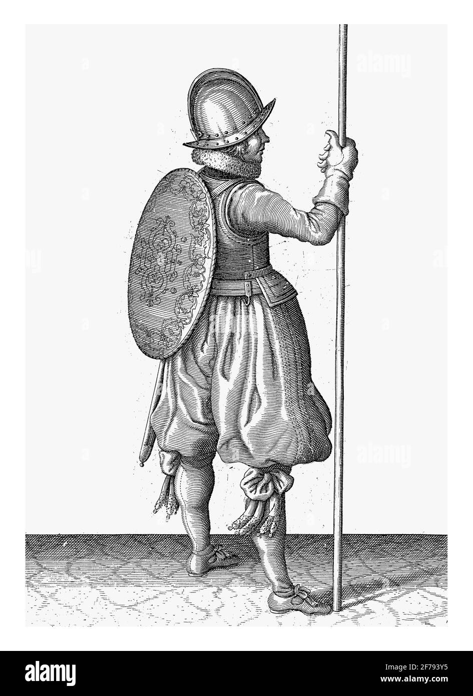 The exercise with shield and spear: the soldier standing with the spear resting on the ground next to the right foot, vintage engraving. Stock Photo