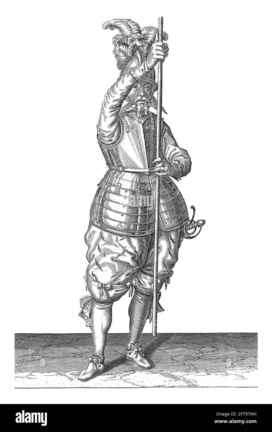 A full-length soldier holding a skewer (lance) with both hands upright in front of him slightly above the ground, vintage engraving. Stock Photo
