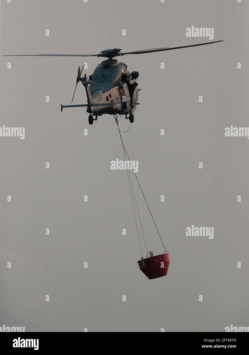 GFS helicopter with fire-bucket, Shenzhen River loop, New Territories, Hong Kong 2nd April 2021 Stock Photo