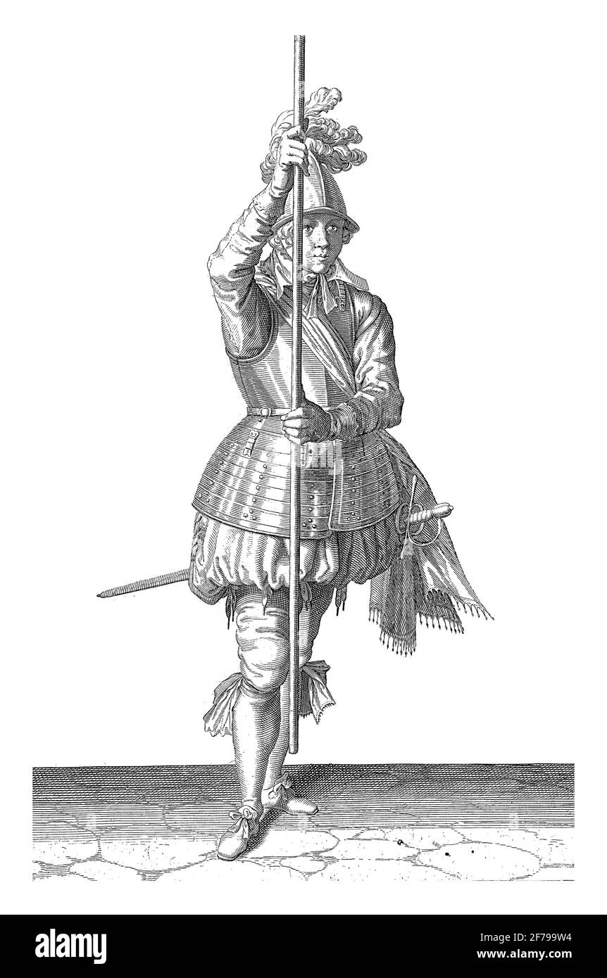Soldier, viewed from the front, holding his spear upright with both hands slightly above the ground, vintage engraving. Stock Photo