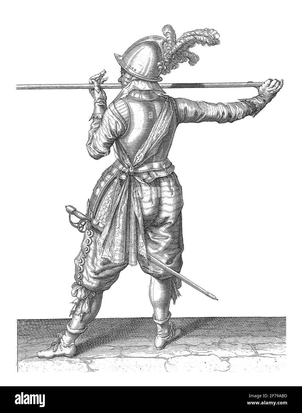 Soldier, seen from the back, carrying his skewer horizontally with both hands at nose height, his right hand at the base of the weapon, his face turne Stock Photo