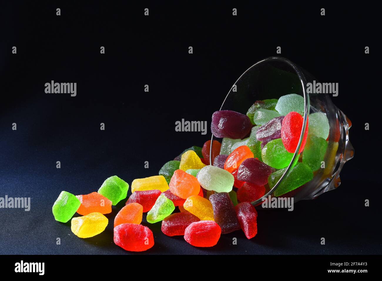 Gummy candies against dark background Stock Photo