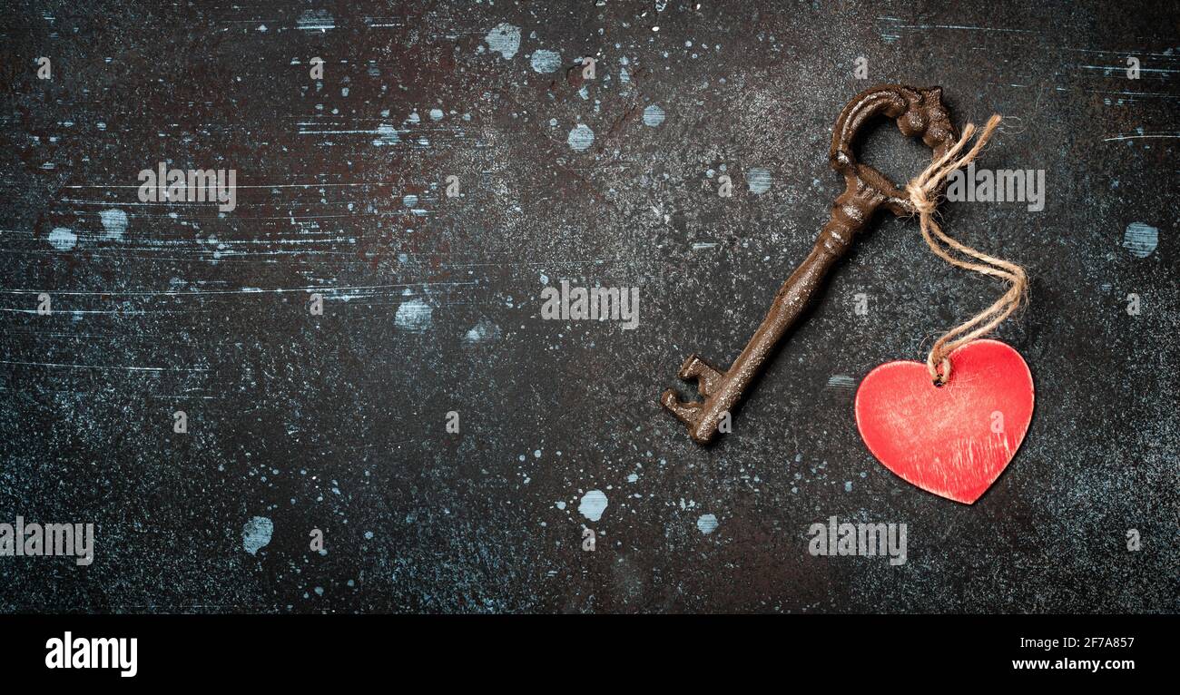 Blue key in heart shape hi-res stock photography and images - Alamy