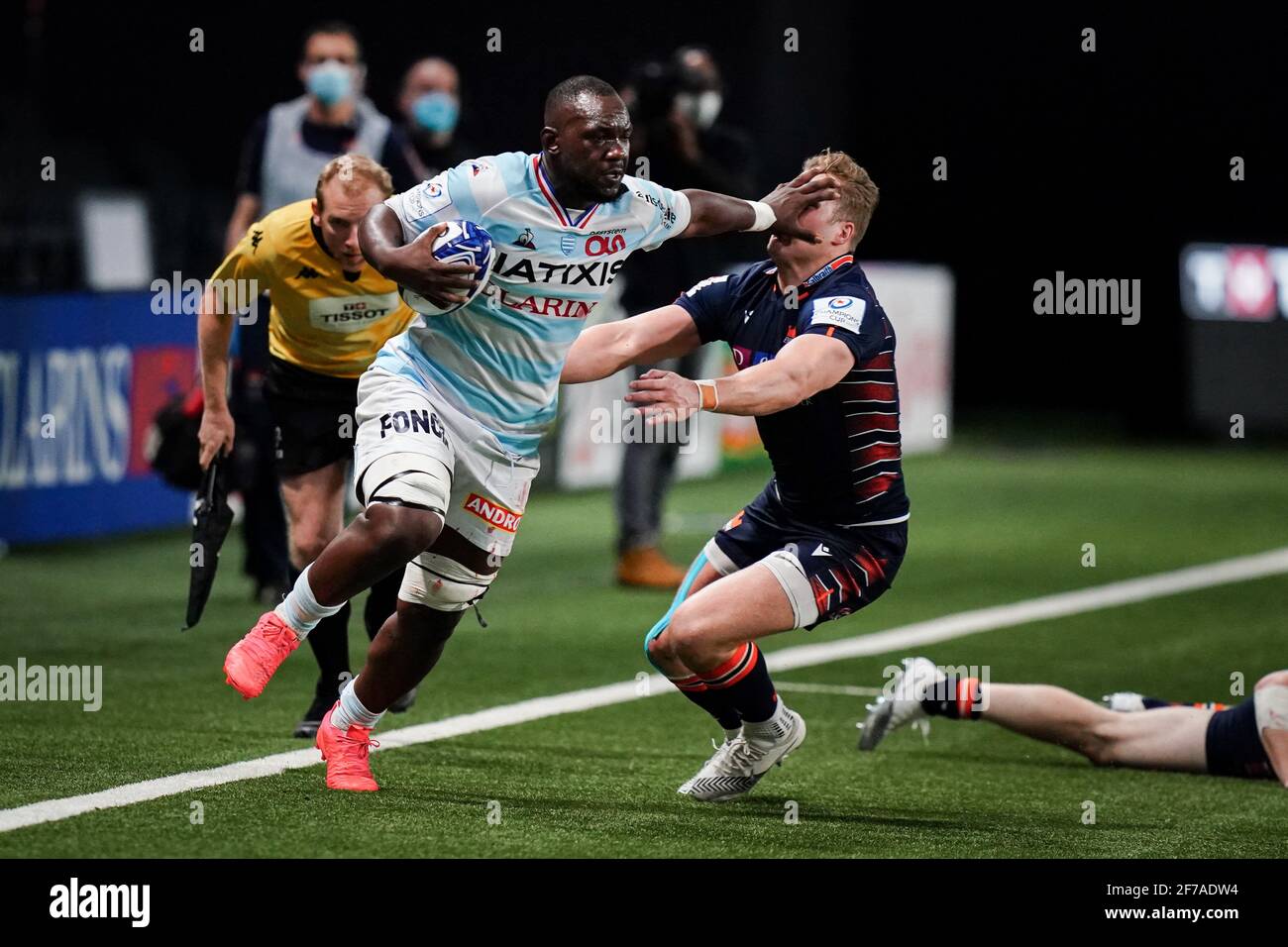 Jordan Joseph (R92) in action with a spectacular Hand-off during the 8th  Finale match of Champions Cup between Racing 92 (R92) and Edinburgh Rugby  (ER) at the Paris La Defense Arena, in
