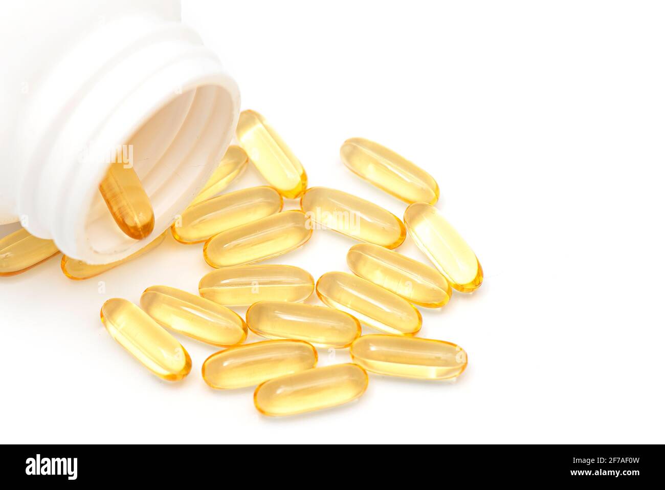 Bottle with pills of omega or fish oil, omega 3 vitamins isolated on white, top view Stock Photo