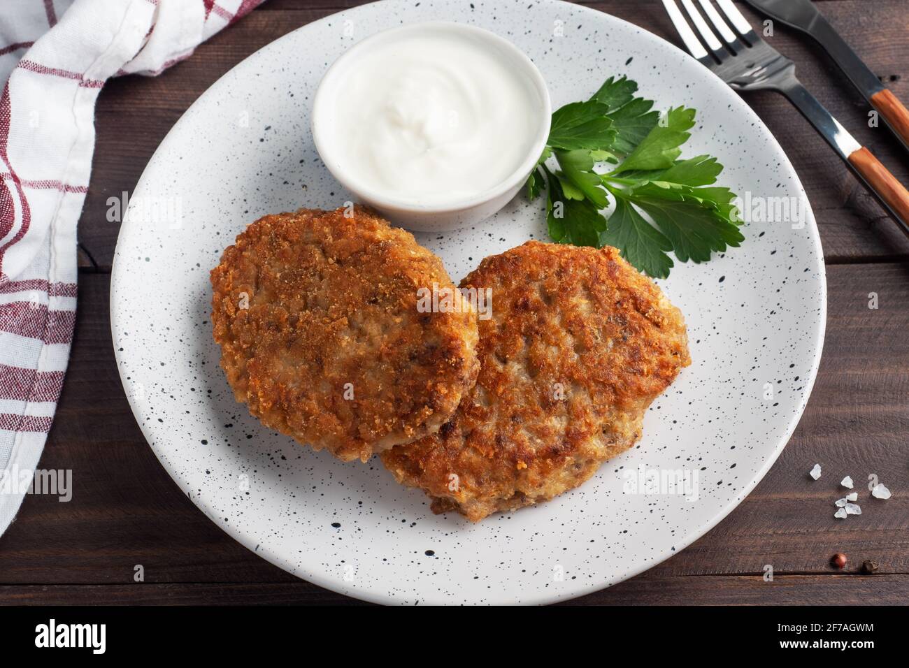 Buckwheat cutlets with cheese and parsley on a plate Healthy diet food Stock Photo