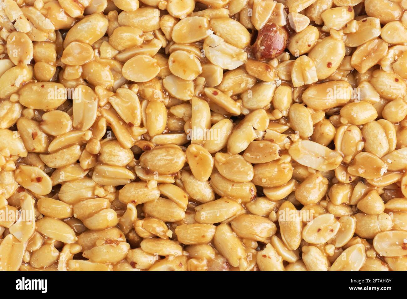 Peanuts in sugar glazed, oriental sweetness of brittle, Close up top view Stock Photo