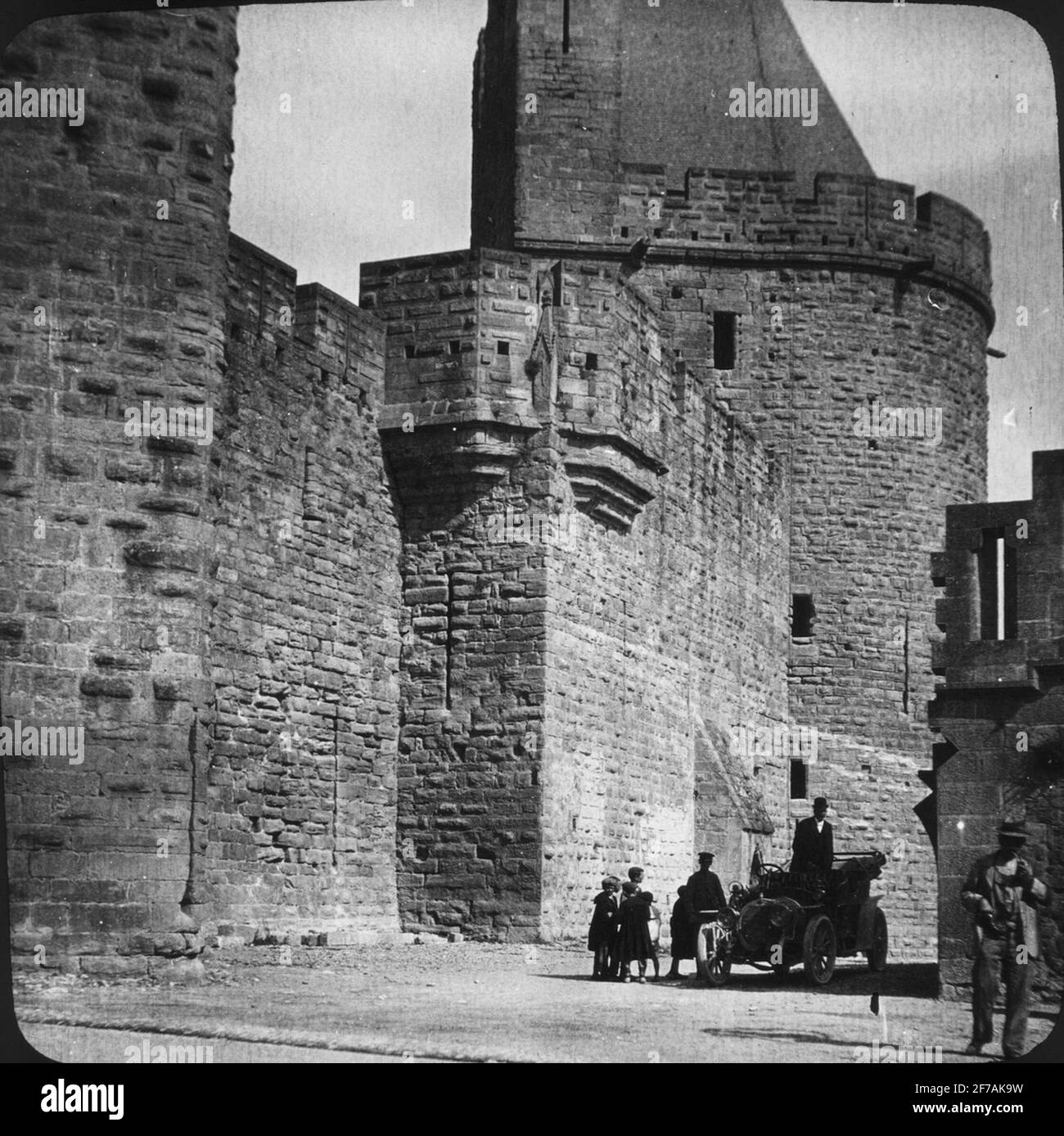 Skioptic image with motifs from medieval castle Cité de Carcassonne. The man at the far right is possibly Paul Clemen.The image has been stored in cardboard labeled: Höstesan 1907. Carcassonne.8. NO: 13. Stock Photo