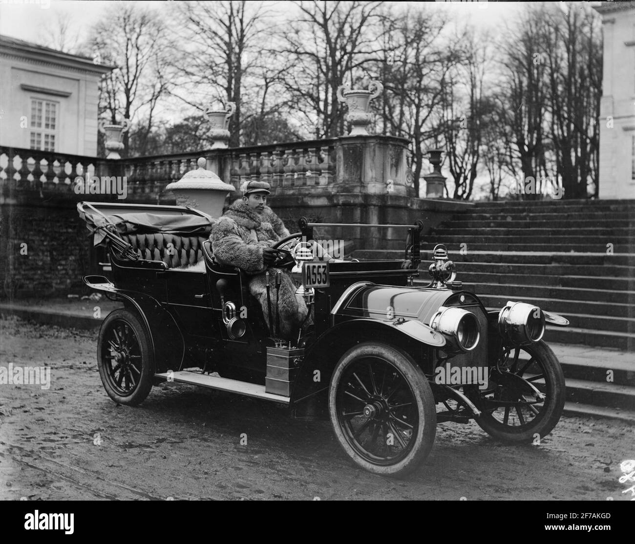 Fur dressed man in automobile. The car possibly manufactured at AB