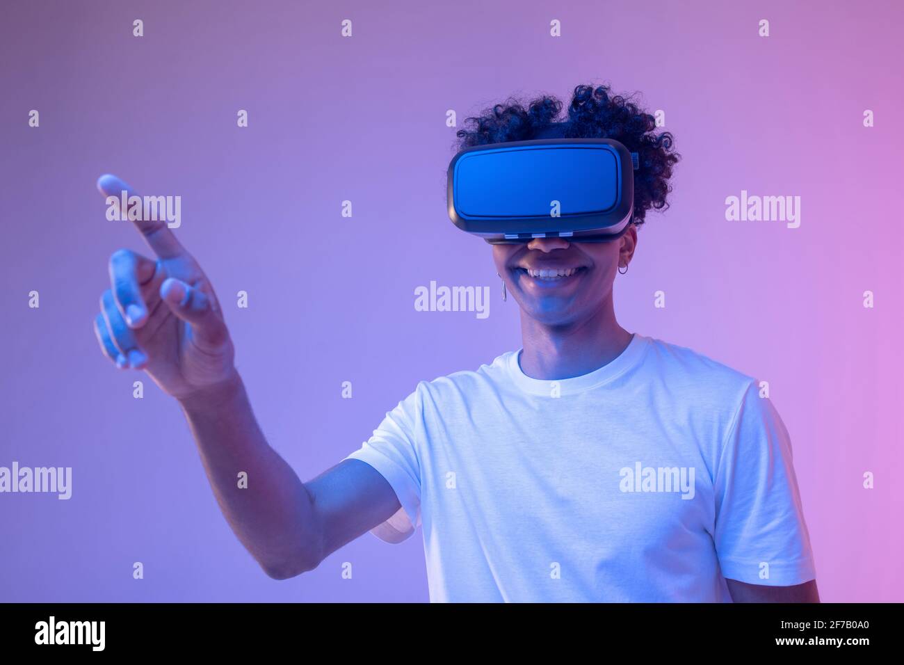 African american young guy in vr glasses enjoying the game Stock Photo ...